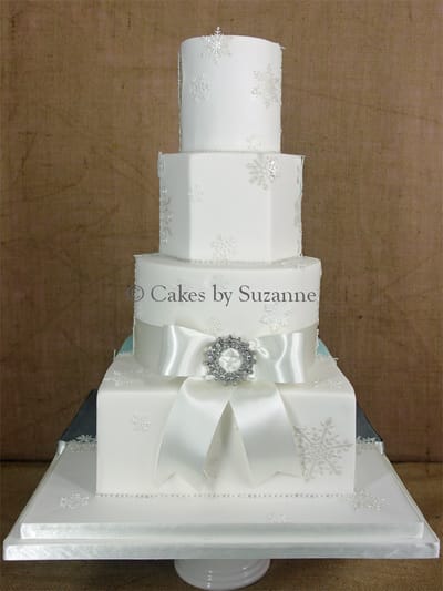 four tier dual theme wedding cake front snowflake winter wonderland back lorry bride groom