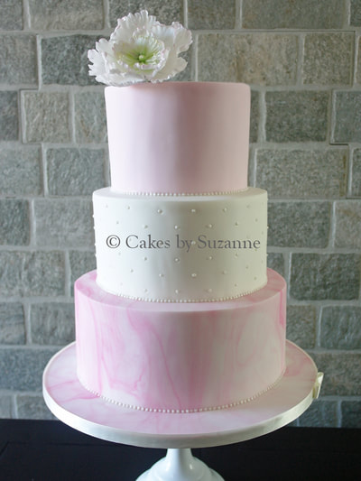 three tier pink white wedding cake marbled flower