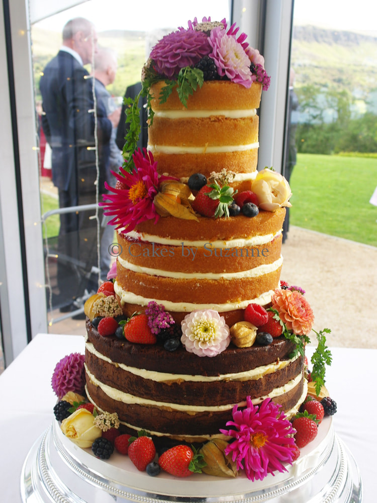 last minute round naked wedding cake with seasonal fresh fruit and flowers