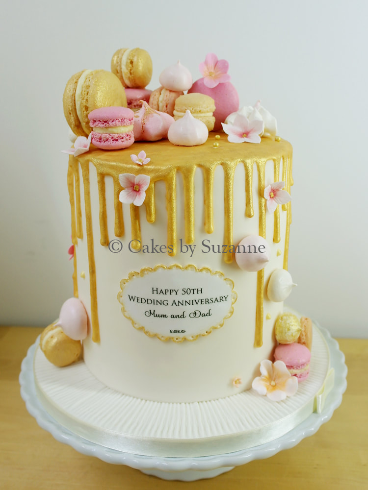 double height 50th wedding anniversary cake gold meringues blossoms
