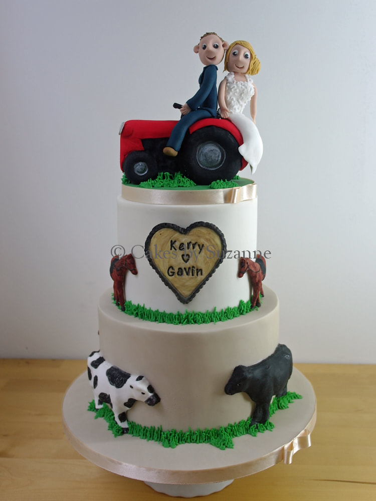 three tier round wedding cake with tractor, bride, groom, cows, horses