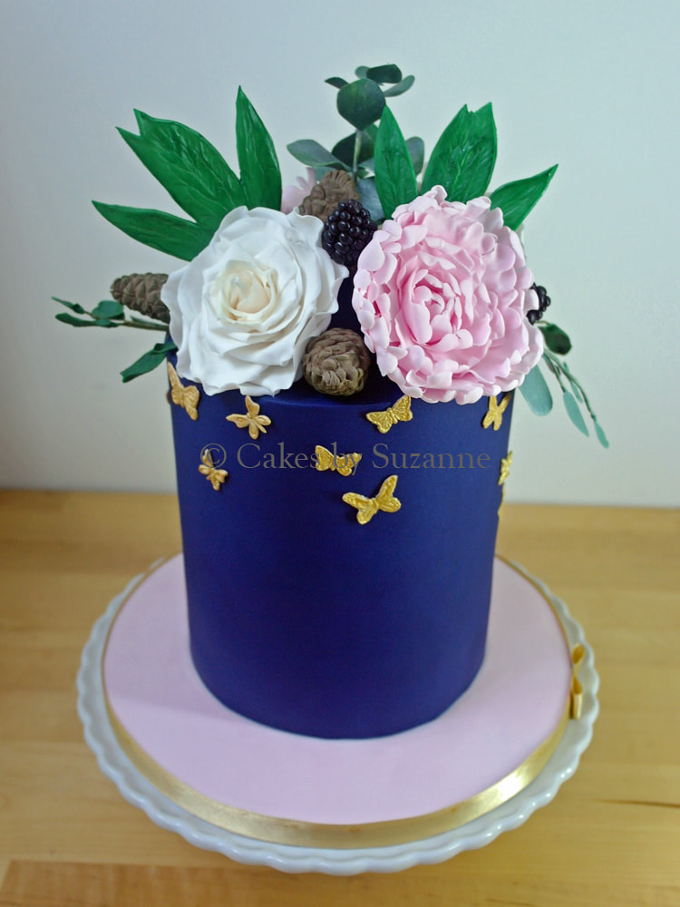 navy birthday cake with roses, peonies, gold butterflies