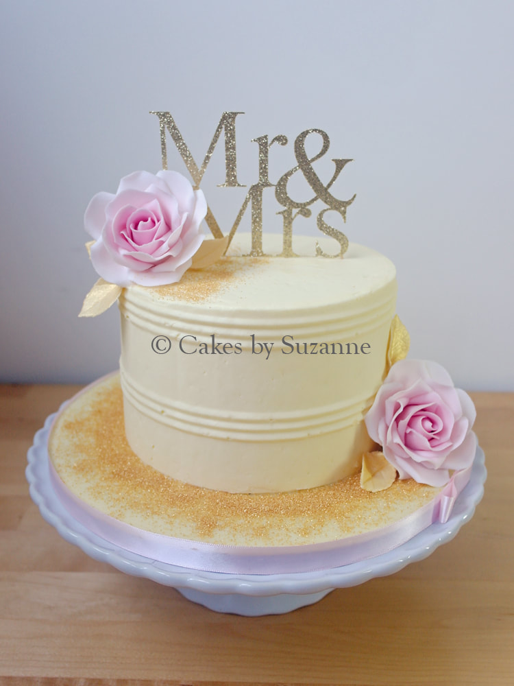 one tier round wedding cake with pink rose gold Mr and Mrs