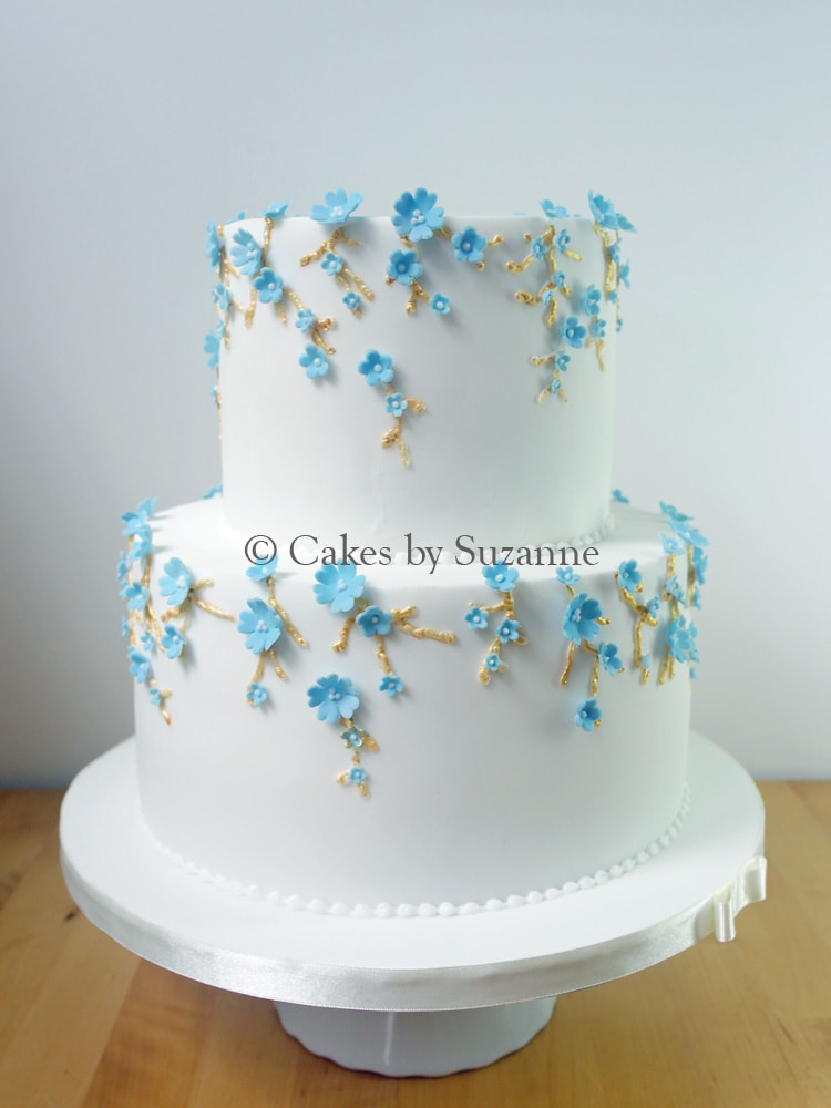 Last minute two tier round wedding cake with blue forget me nots.