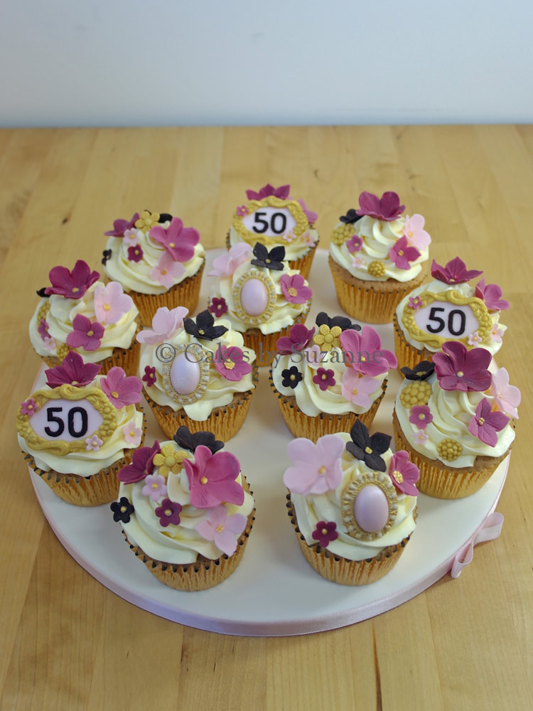 50th birthday cupcakes with vintage brooches and flowers