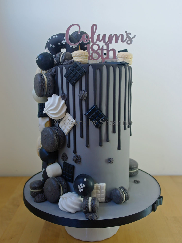 double height (2 tier) drip effect cake with personalised topper, macarons, meringues doughnuts and mini chocolate bar cascade