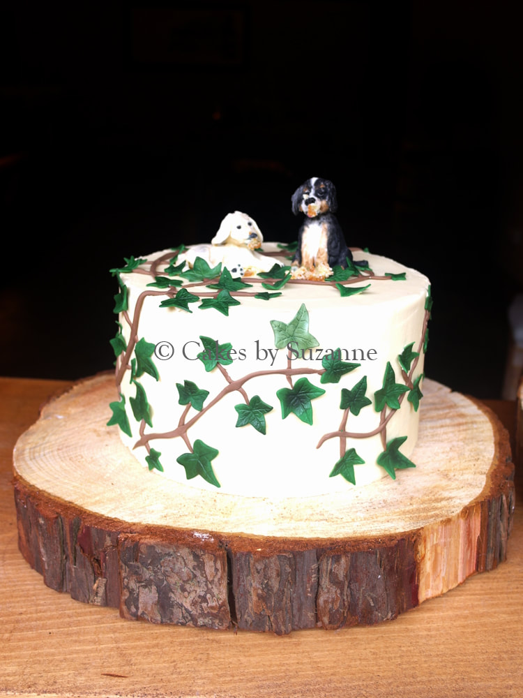 single tier rustic buttercream wedding cake with sugar ivy and hand made dog characters