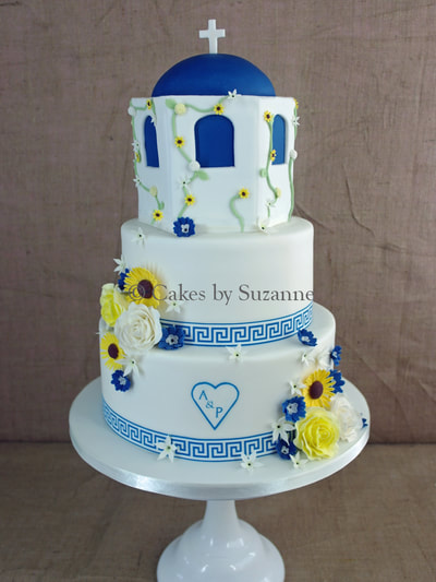 three tier wedding cake round Greek Santorini theme sunflowers blue