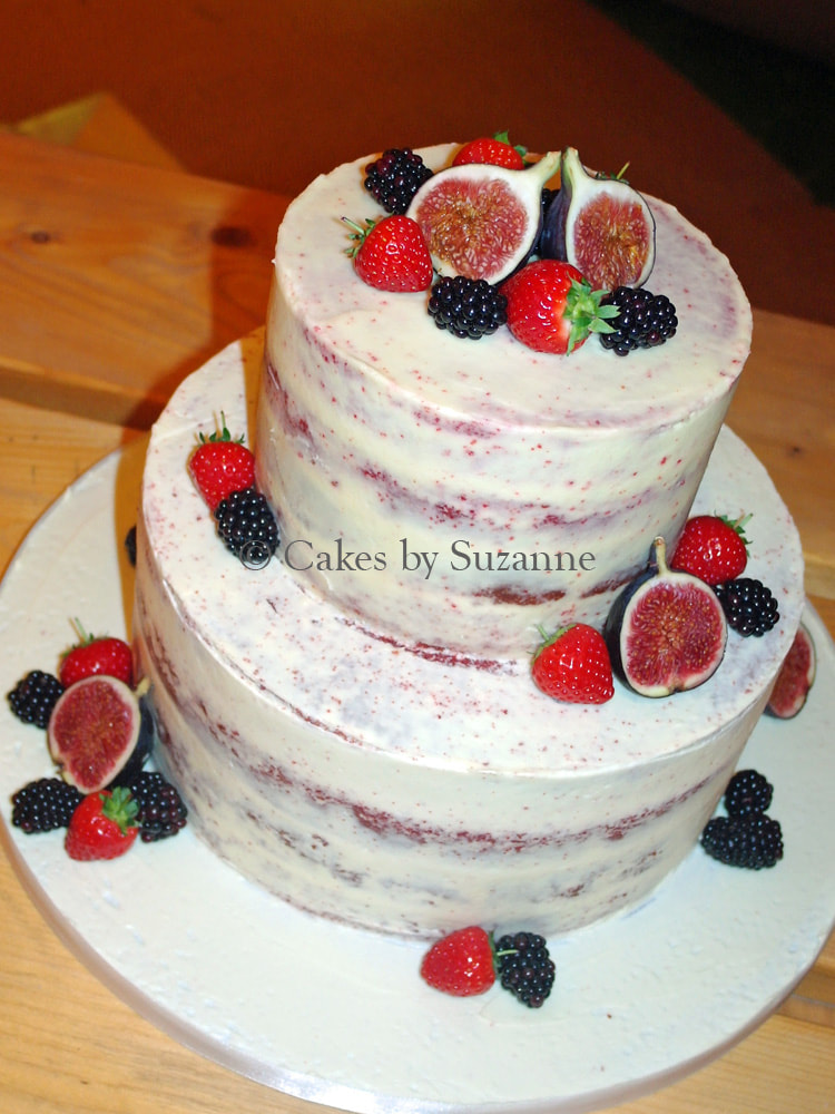 last minute two tier round semi naked wedding cake with fresh fruit