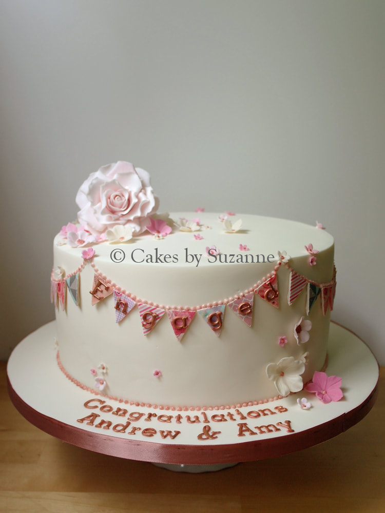 Engagement celebration congratulations cake bunting rose blossoms