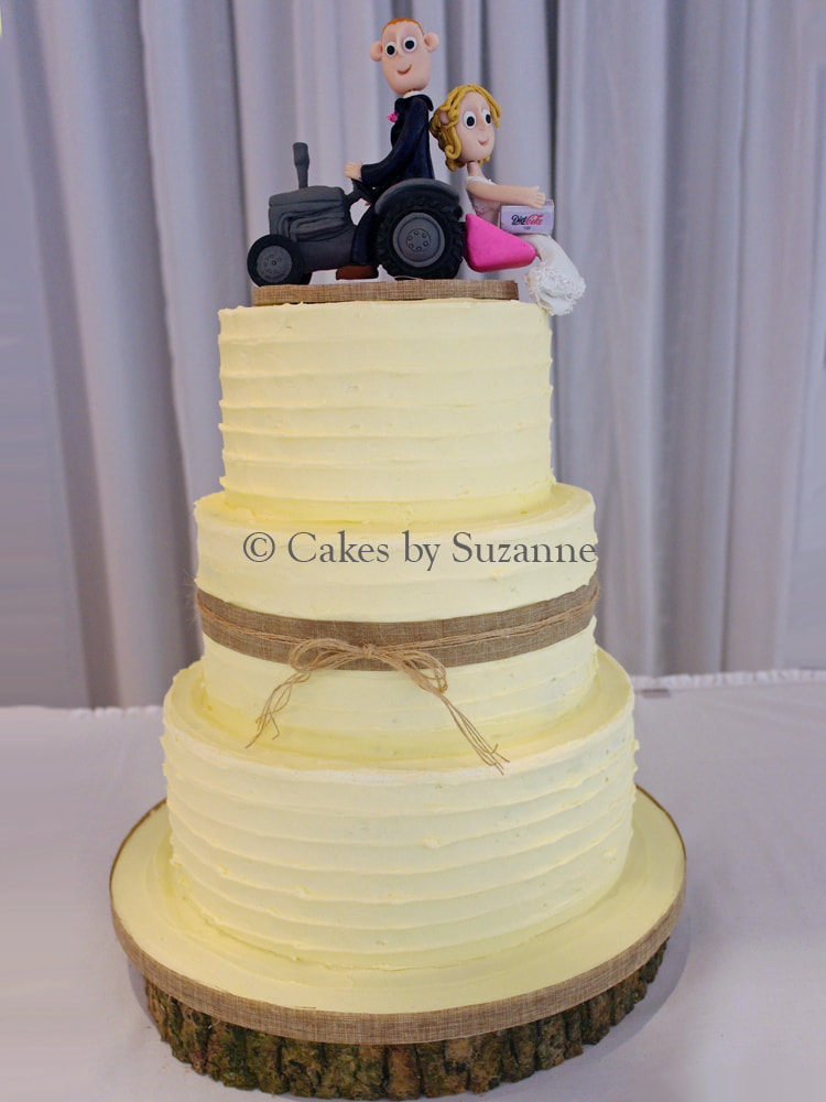 three tier round rustic buttercream wedding cake bride groom tractor link box