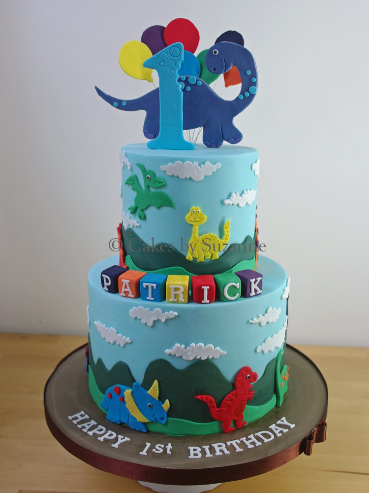 two tier round cute dinosaur birthday cake