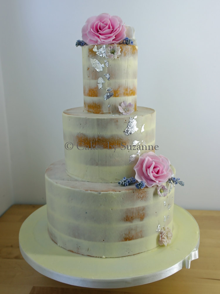 three tier round semi naked wedding cake with silver leaf pink roses