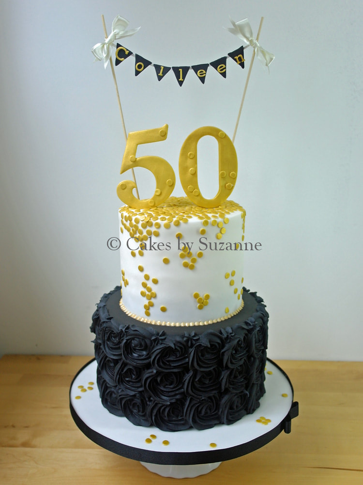 two tier round 50th birthday cake black rose swirls gold bunting