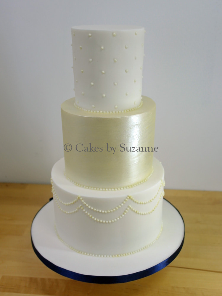 three tier round wedding cake plain lustred piped