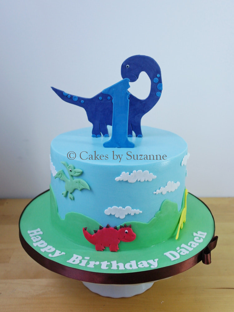 single one tier round cute dinosaur birthday cake
