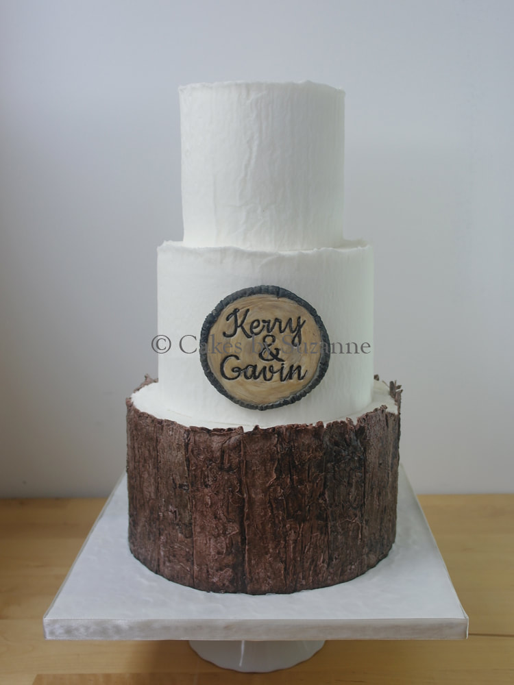 three tier round buttercream wedding cake with rustic tree bark effect