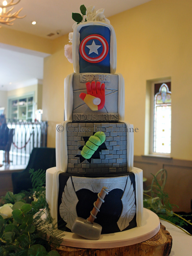 four tier dual theme wedding cake flower cascade Superhero