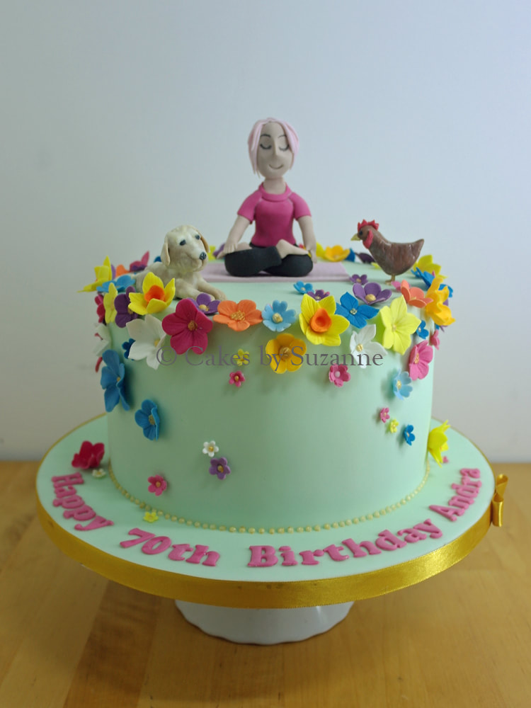 bright floral birthday cake with sugar models