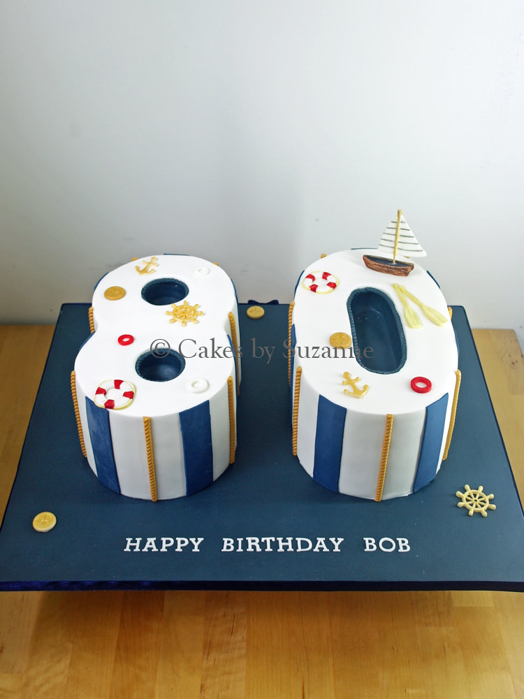 80 number birthday cake with a sailing theme