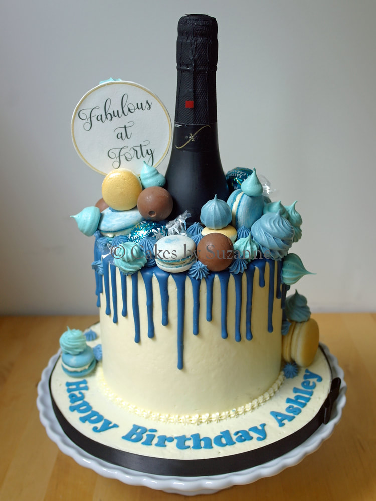 40th birthday drip effect cake with added prosecco bottle, macarons, meringues and sign
