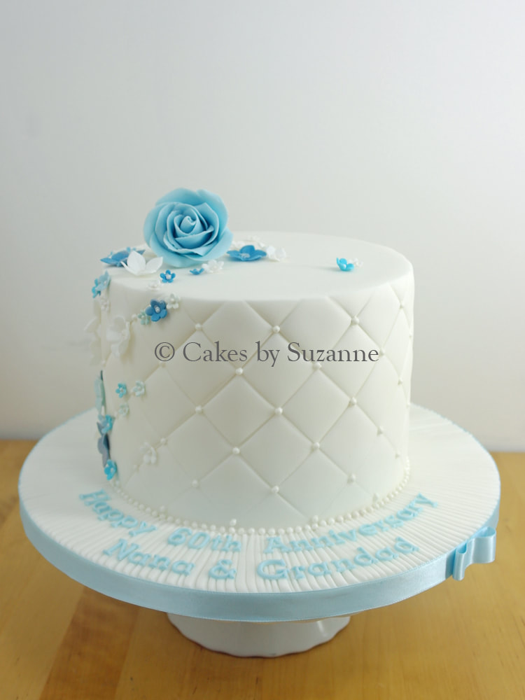 60th wedding anniversary cake with blue flowers and message