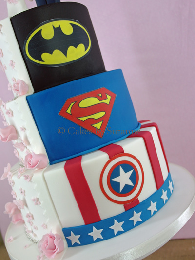 three tier round split theme wedding cake pink flowers bride groom Batman Superman Captain America