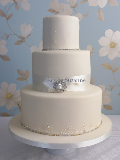 last minute round three tier wedding cake with ribbon and brooch, pearls and diamante